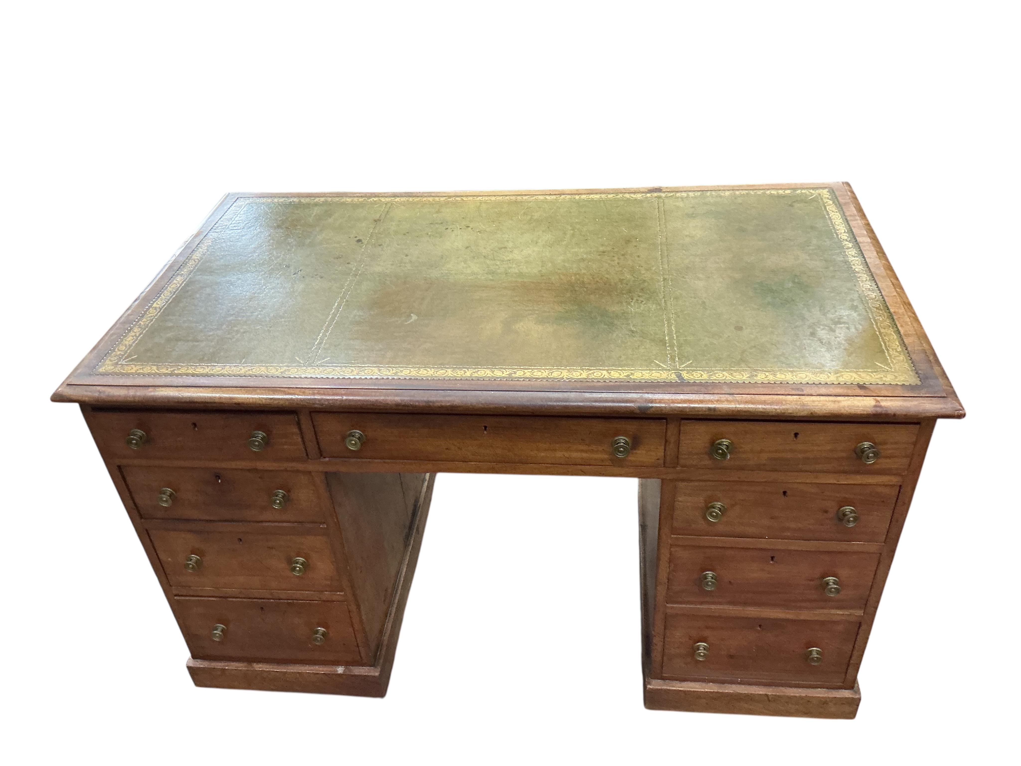 A Victorian faded mahogany kneehole desk with leather inset top, width 127cm, depth 71cm, height 77cm